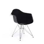 Oviedo B 1 dining chair made with black
  glossy fiberglass frame and stainless steel wired legs – angle view