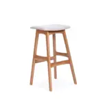 Ramp 2 counter stool made with premium
  cream leather upholstered seat and solid ashwood wooden legs – angle view
