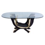 Aurelius 1 dining table made with
  tempered glass top and cast brass & bronze base – main view