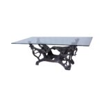 Canopy 1 dining table made with tempered
  glass top and cast bronze base – main view