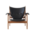 Hudson A 1 lounge chair made with premium
  black leather seat and solid American walnut – main view